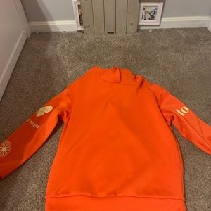 orange hoodie with designs
